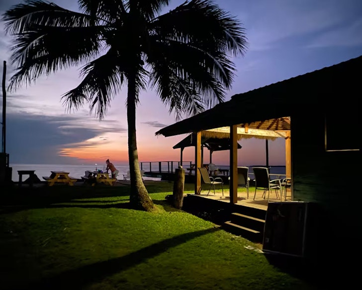 An external view at sunset of Belles On Ballow best accommoation Stradbroke Island