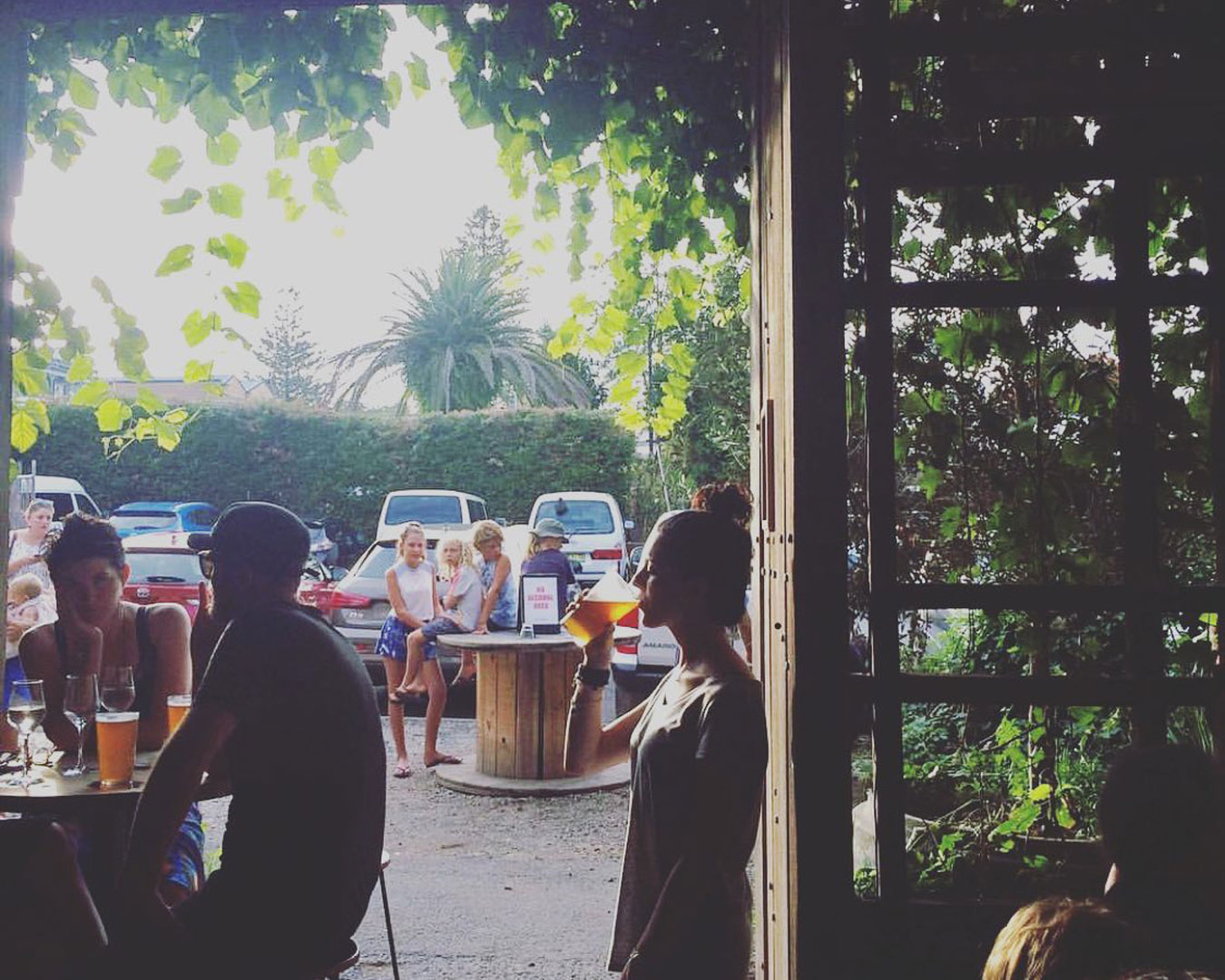 Plant-filled bar with people drinking