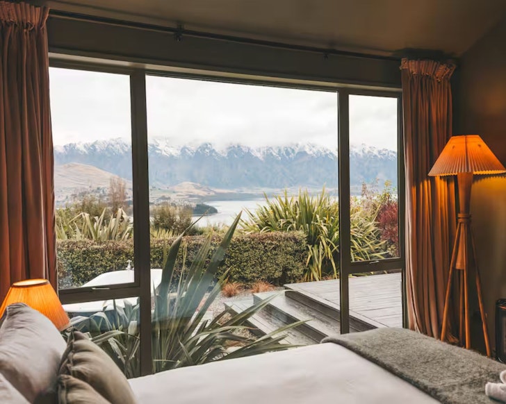 A view of the mountains from the bedroom of the Bespoke Stay romantic Airbnb in Queenstown, New Zealand