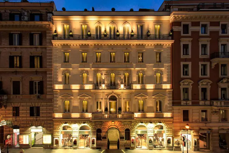 Best affordable hotels in Rome at Hotel Artemide with illuminated exterior on Via Nazionale