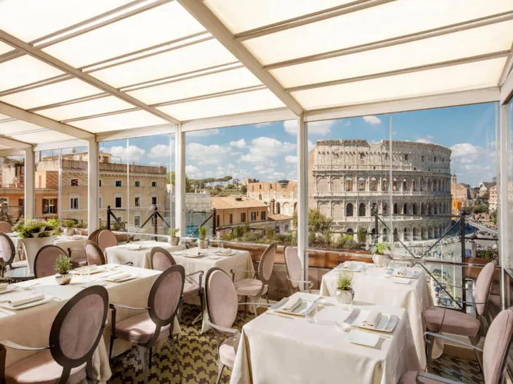 Best hotels in Rome at Palazzo Manfredi with dining room views directly onto the Colosseum
