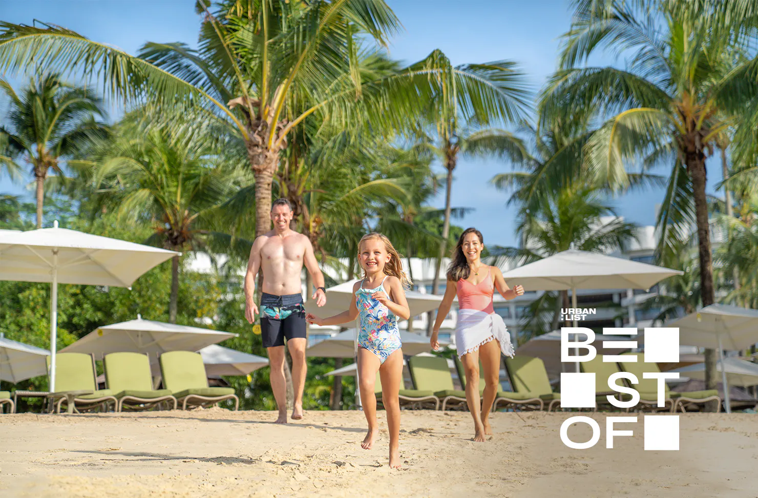 A family on the beach at Shangri-La Rasa Sentosa