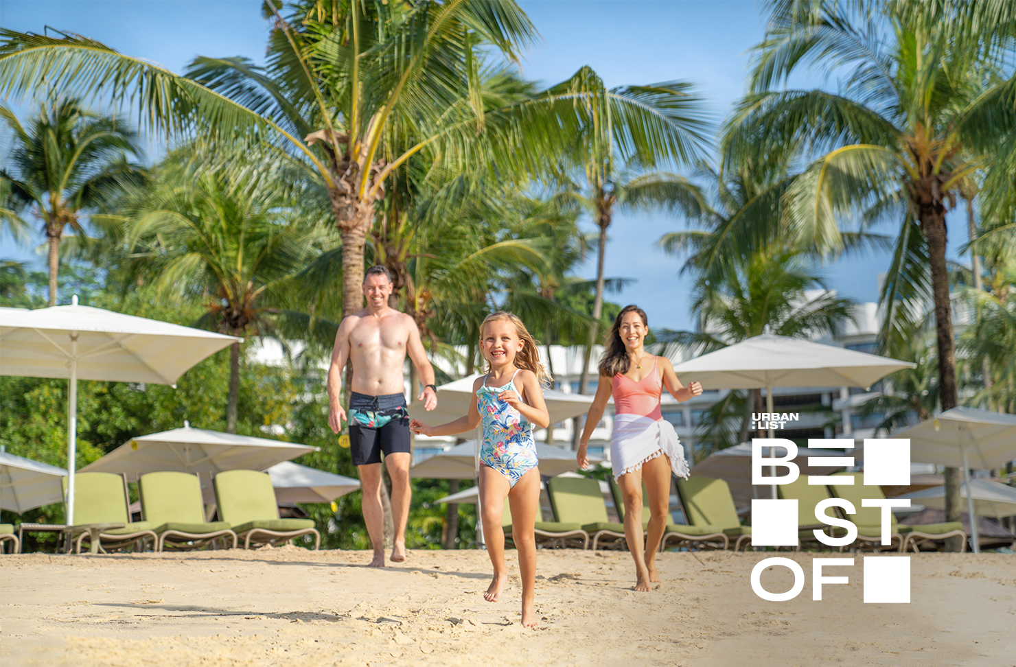 A family on the beach at Shangri-La Rasa Sentosa