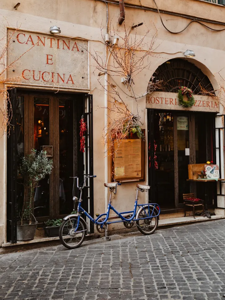 Best pasta in Rome at Cantina e Cucina with a charming Italian storefront