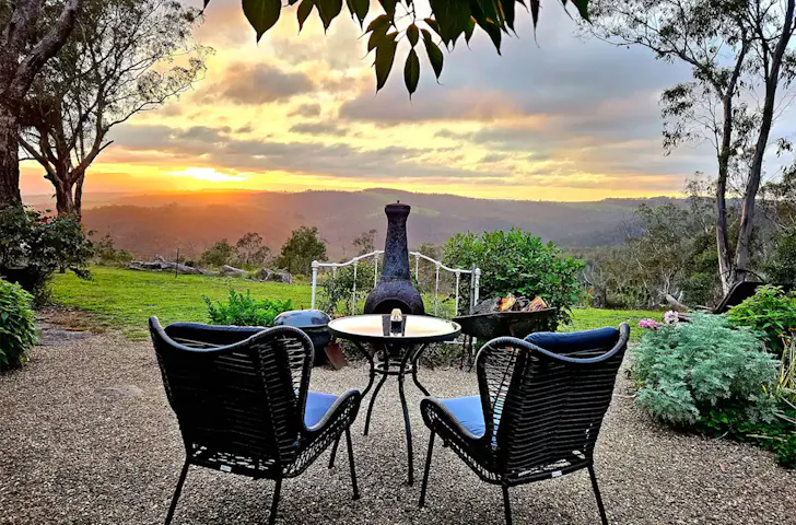 Two chairs looking out at the view at Wattle Views pet-friendly Airbnb near Sydney