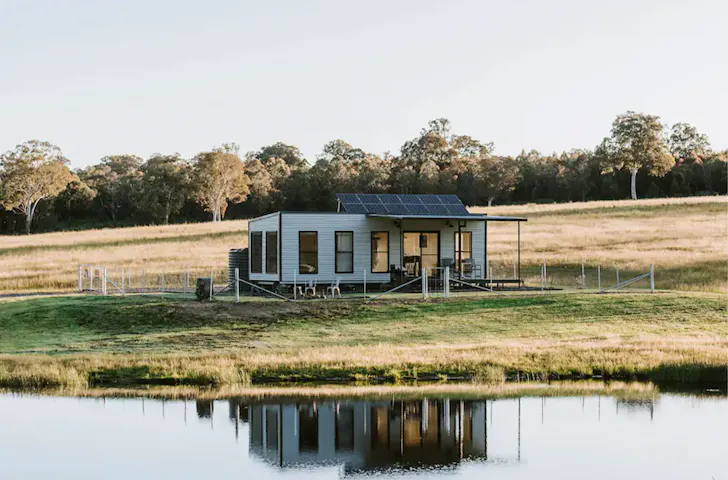A view of Hepburn Retreat Airbnb surrounded by farmland. It's one of the best pet-friendly stays near Sydney