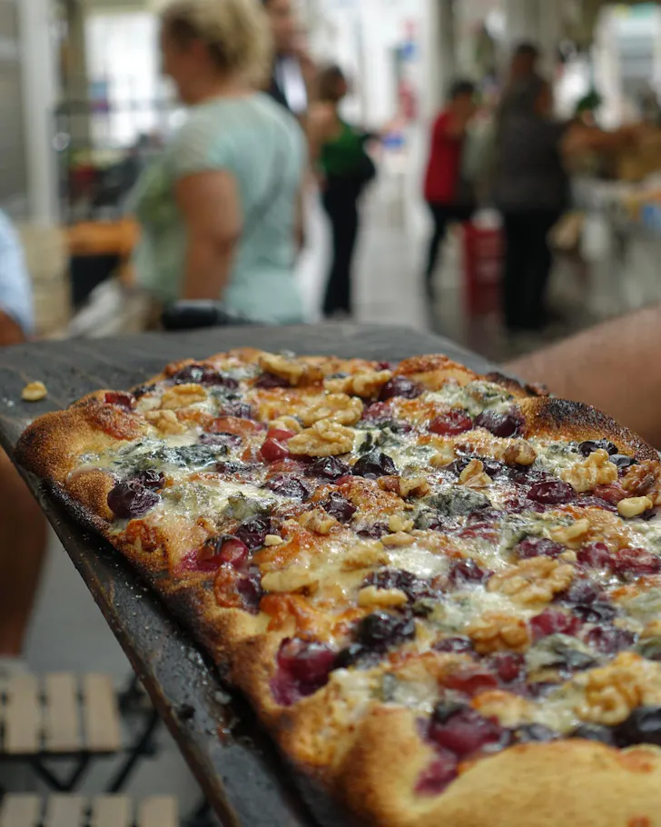 Best markets in Rome at Testaccio Market with Casa Mancoâs rectangular pinsa-style pizza al taglio