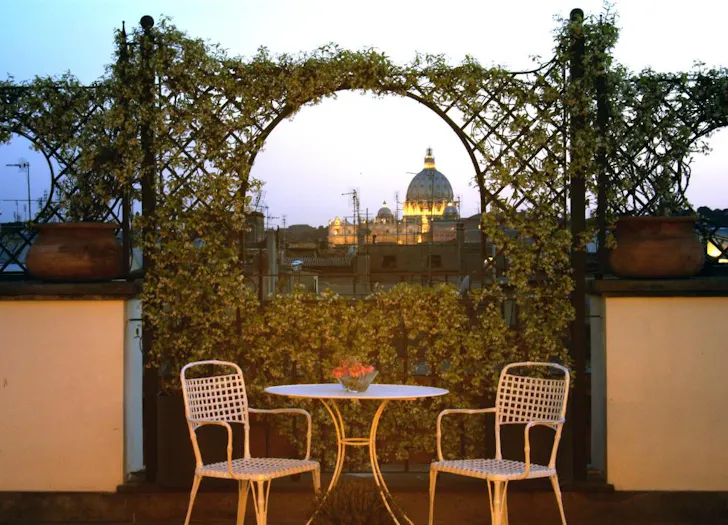 Best places to stay in Rome at Hotel Isa with rooftop garden and sunset views over St Peterâs dome