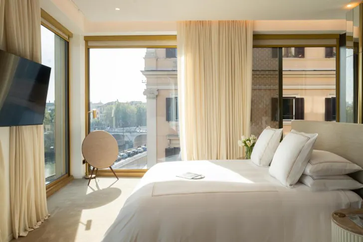 Best places to stay in Rome at The First Musica with classic room and floor-to-ceiling windows overlooking the Tiber