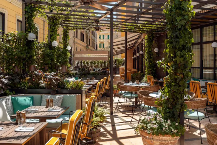 Best places to stay in Rome at The Hoxton Rome with a leafy, sunny outdoor dining area and terrace