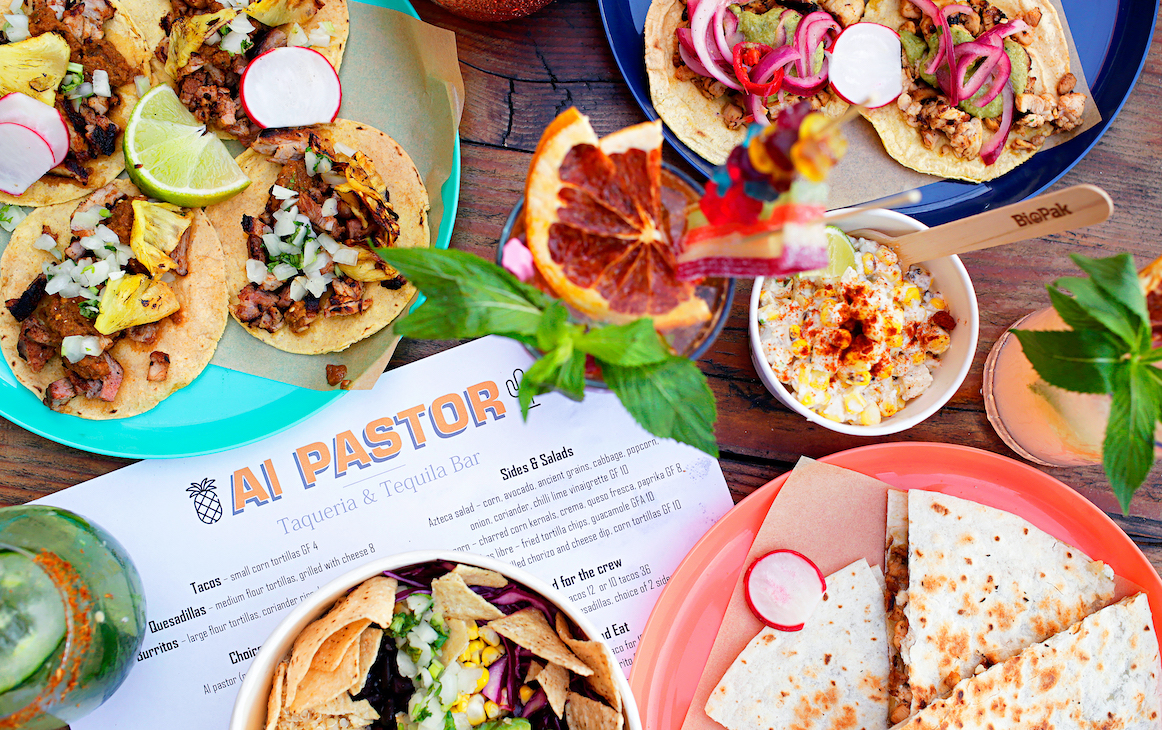 Table loaded with tacos, tostadas, cocktails and more at Al Pastor in Fremantle