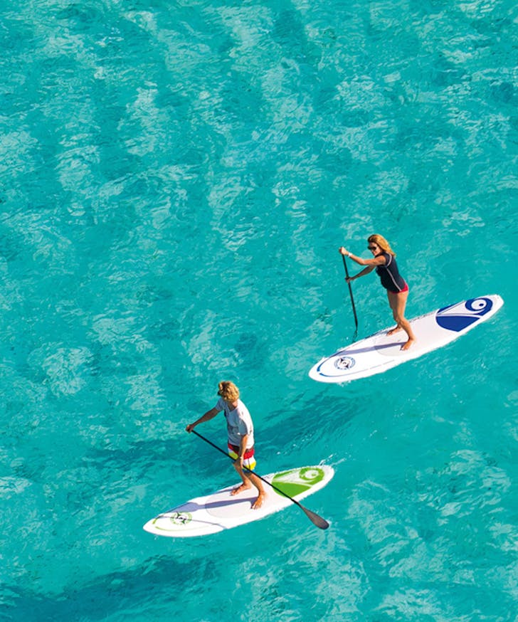 People stand up paddle boarding