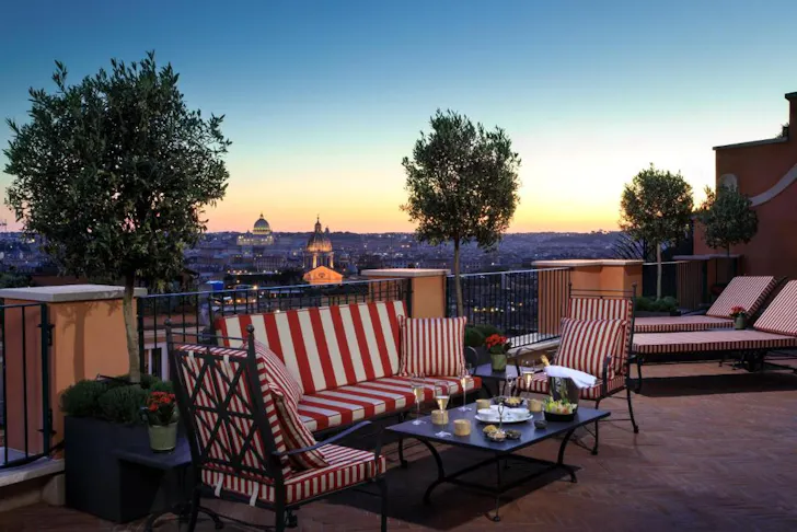 Best rooftop bars in Rome at Cielo with an outdoor terrace seating area lit up at night