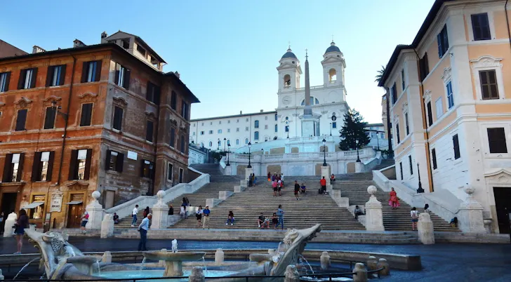 The Spanish Steps in Rome with the Barcaccia fountain and the Trinita dei Monti church in the background