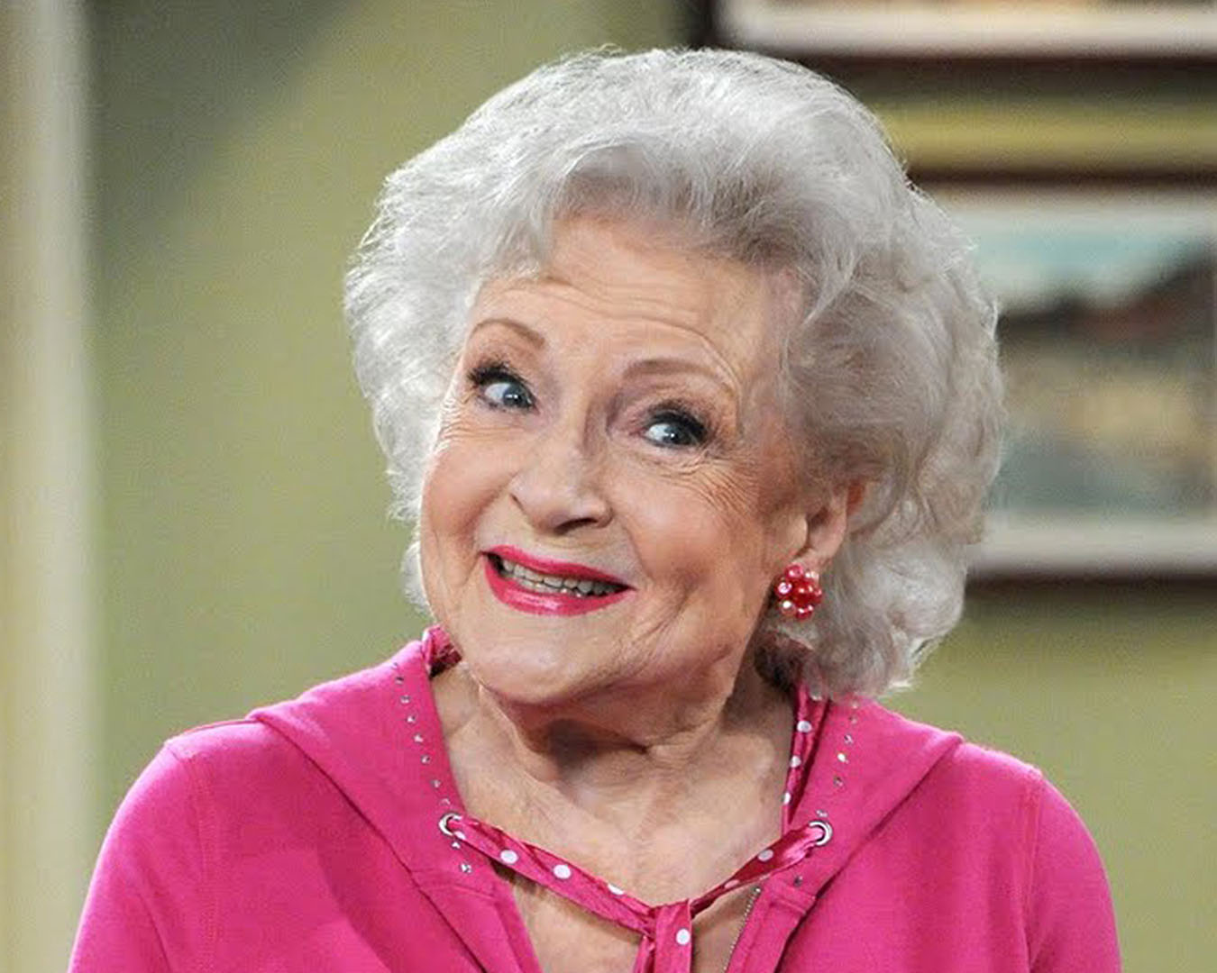 Betty White smiles at the camera.