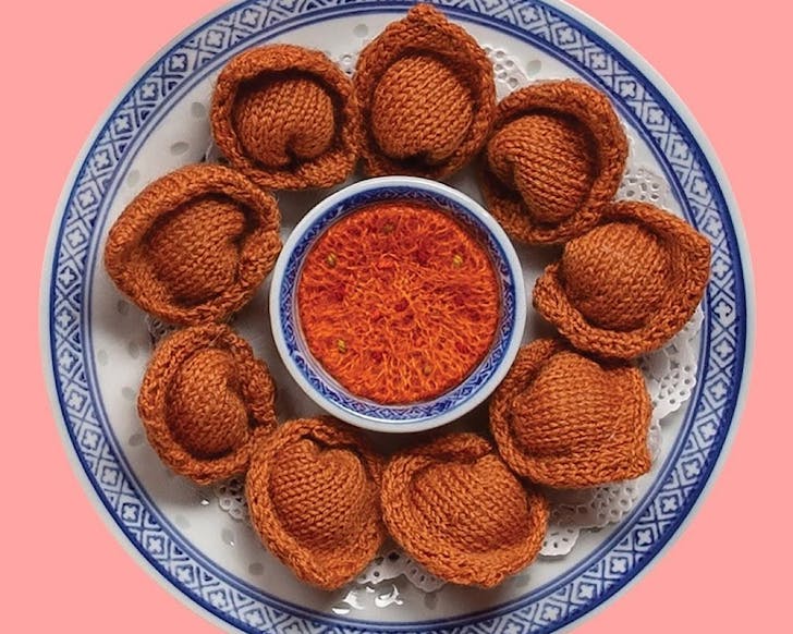 Knitted dumplings by Bev Moon, as part of the Wellington-based exhibition, Fortune. 