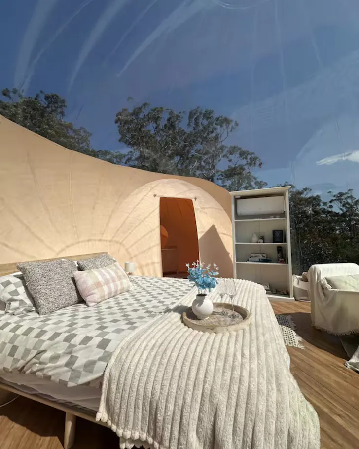 The bed inside the bubble at Beyond Bubbles one of the best NSW romantic getaways