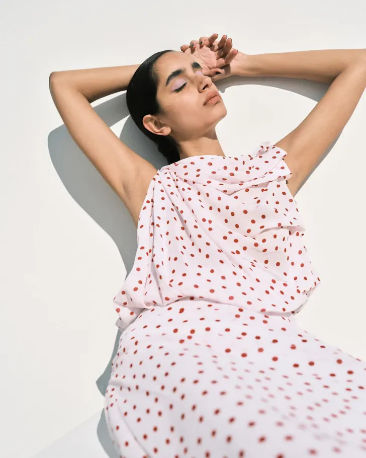 A model wears a polkadot dress from Bianca Spender one of the best Australian fashion labels