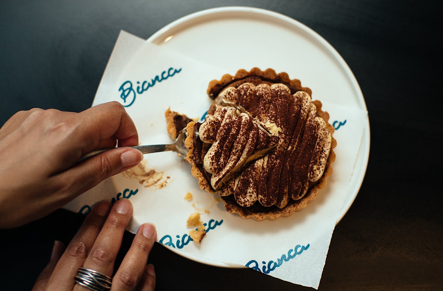 Armelle slices into a tiramisu by Bianca. 