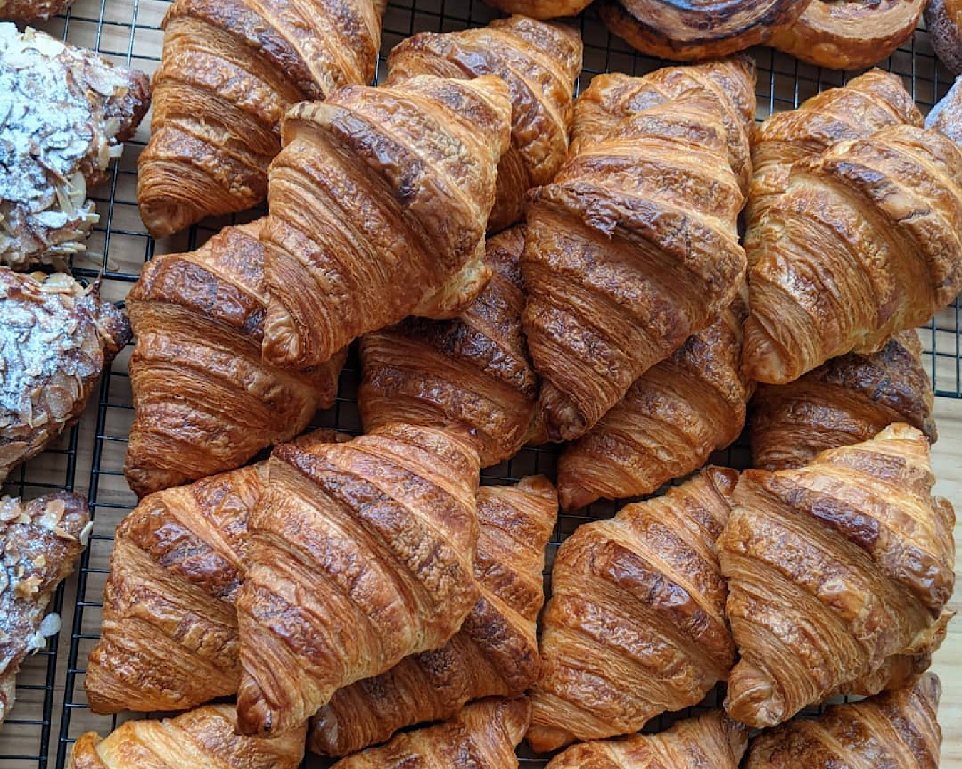 A pile of croissants from Billow (with a glimpse of almond croissants off to the left), one of the best bakery-cafes in New Plymouth. 