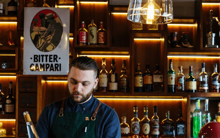 A bartender preparing drinks at a top cocktail bar in Melbourne