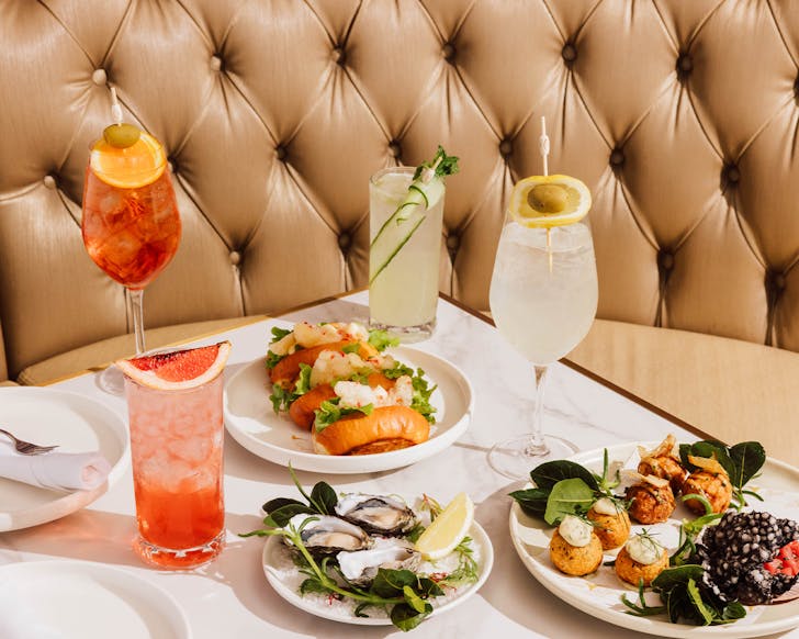 a table with food and cocktails