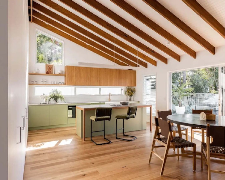 Kitchen with exposed timber rafters