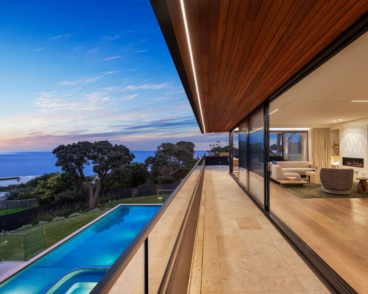 The pool and indoor/outdoor living space at Blanc de Noir luxury Airbnb accommodation Mornington Peninsula
