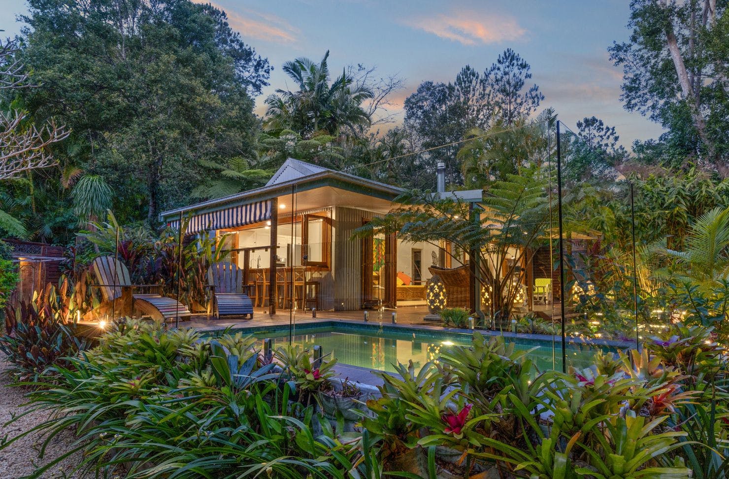 A view of the house and pool at Bliss Cottage resort-style Airbnb Byron