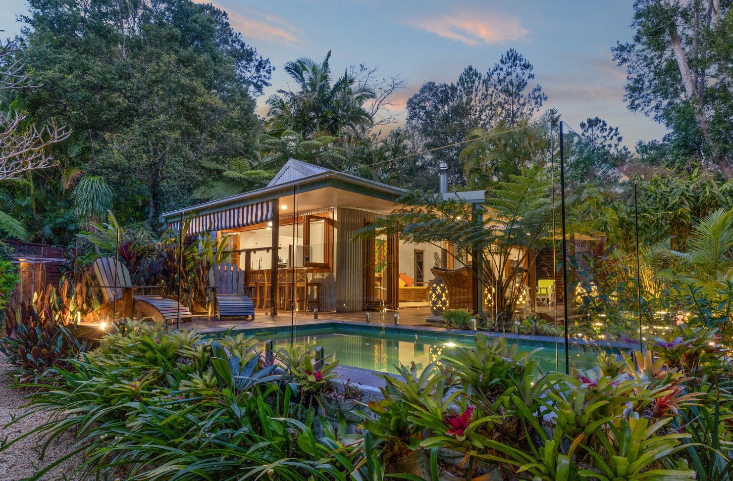 A view of the house and pool at Bliss Cottage resort-style Airbnb Byron