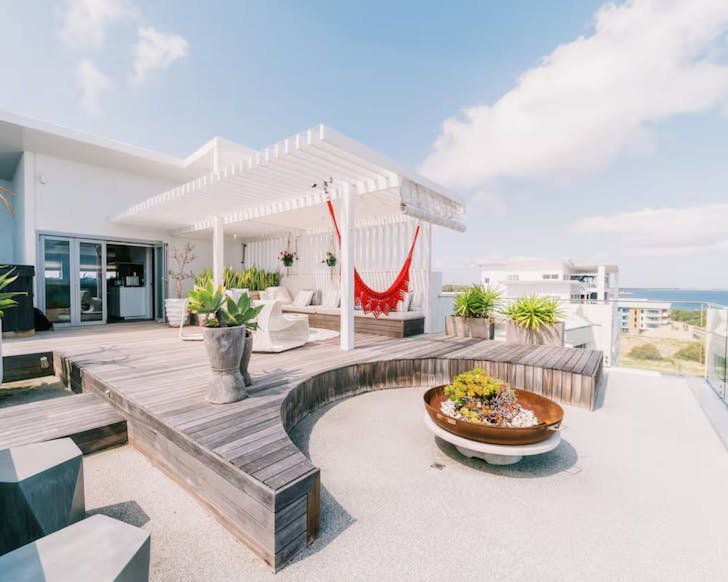The huge outdoor deck with the sea in the background at Blue Peter Penthouse WA
