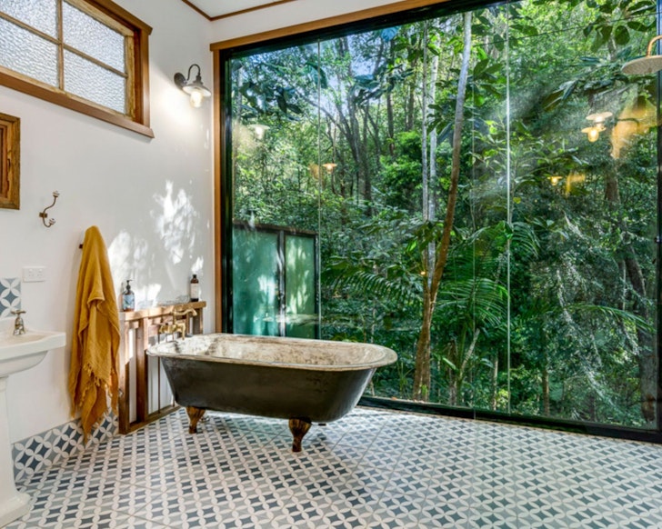 A view of trees from the bath at Bluebird best treehouse stays Queensland