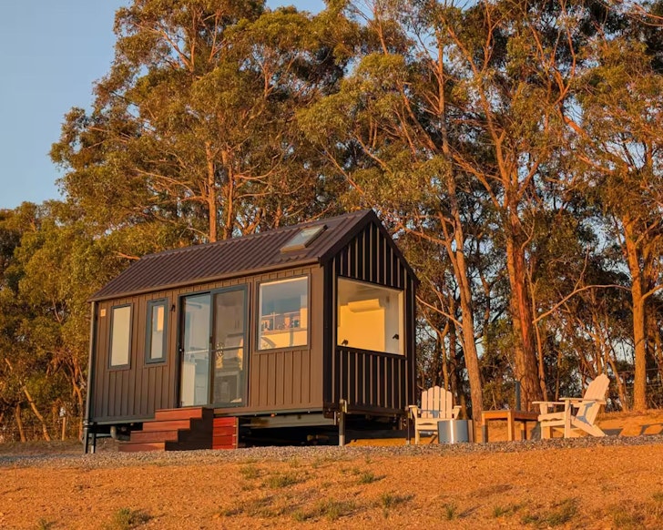 A view of Blumenfeld tiny home bathed in golden light, it's one of the best tiny homes in Adelaide and South Australia