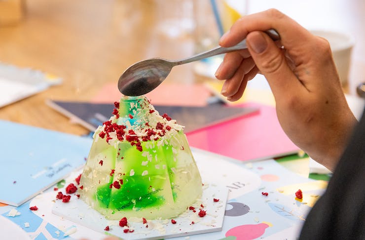 A spoon dives into a jelly creation.
