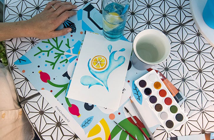 Painting accessories sit on a table.