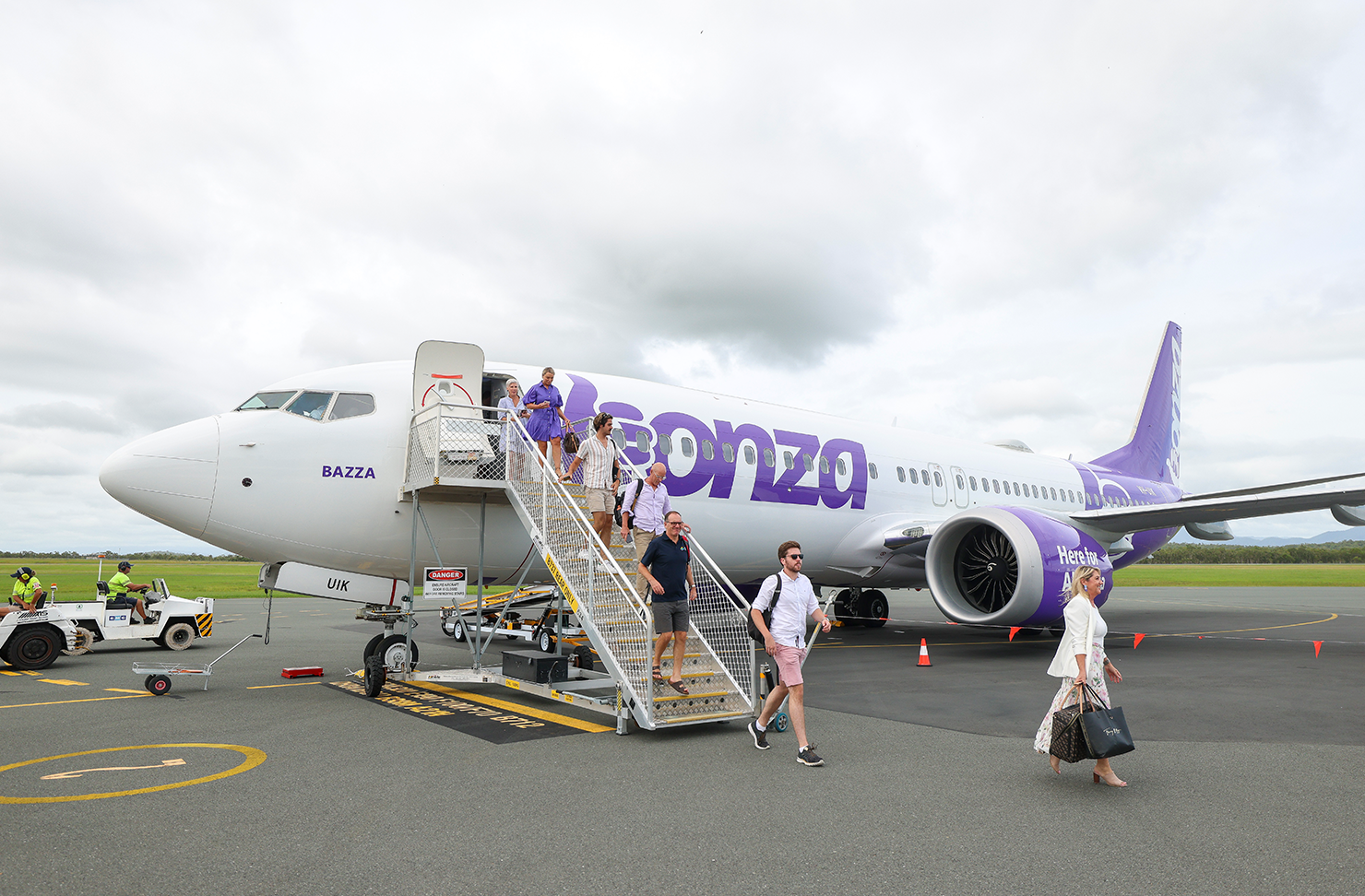 people stepping off a bonza plane