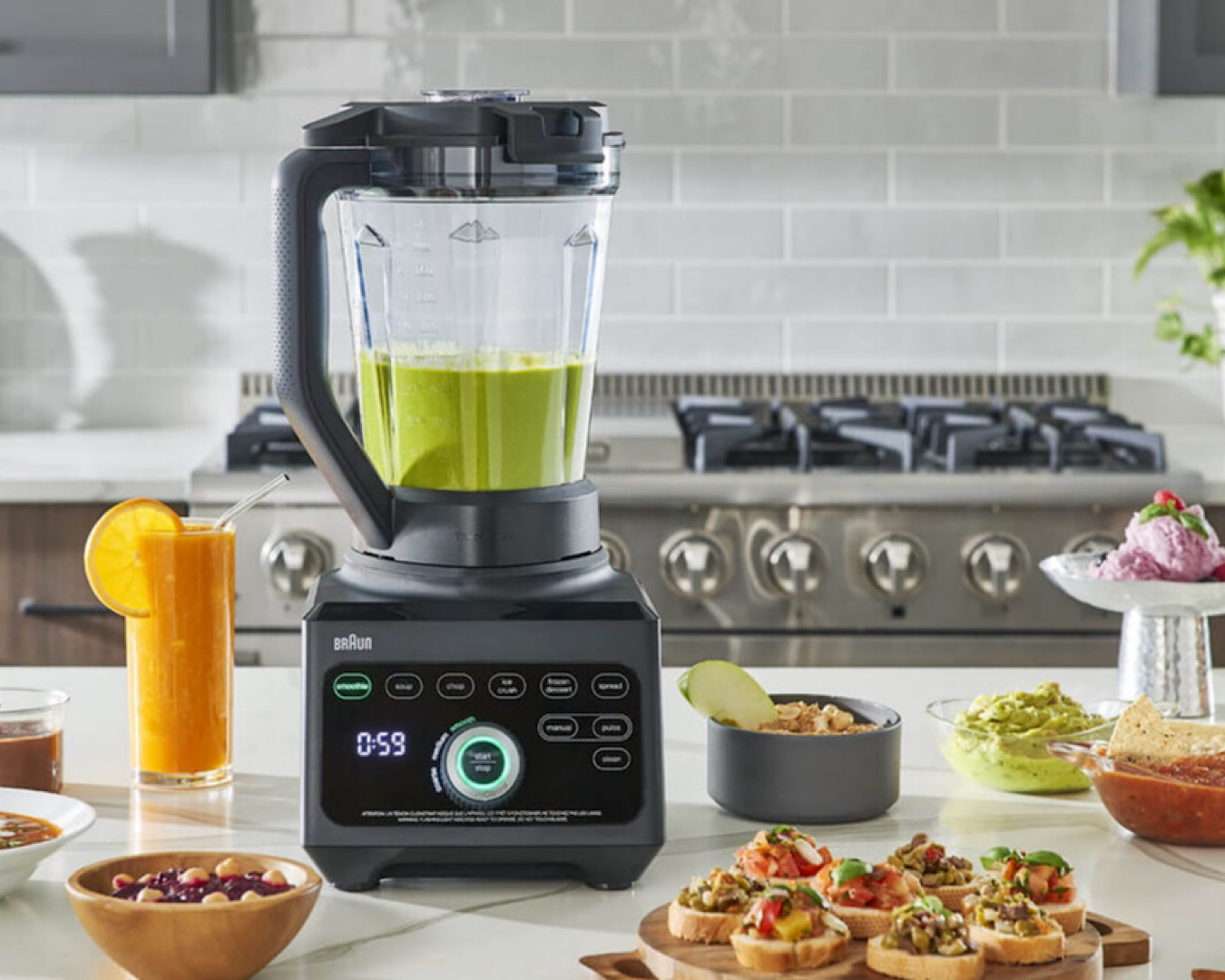A Braun PowerBlend 9 Jug Blender proudly surveying the nuts and vegetables it’s reduced to liquid and near-liquid.