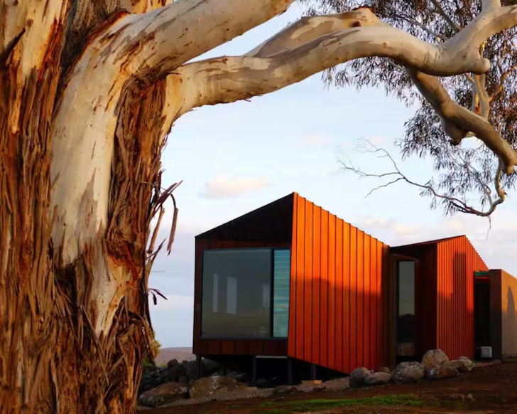 The orange exterior of Breakneck Gorge Oikos Airbnb one of the best accommodation options in Daylesford