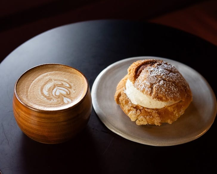 Coffee made from in-house roasted beans and served with a cream bun.