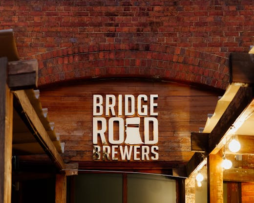 A brick wall with a sign that reads 'Bridge Road Brewers'