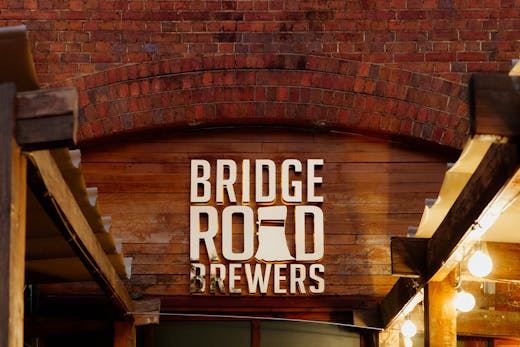 A brick wall with a sign that reads 'Bridge Road Brewers'