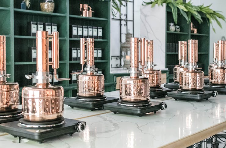the copper stills inside the distillery's gin school