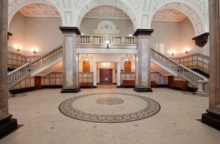 interior of brisbanes town hall with a grand staircase
