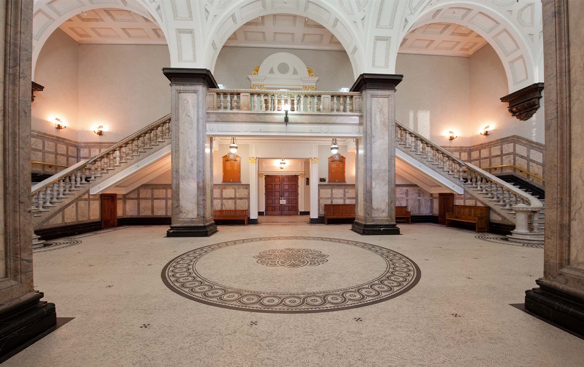 interior of brisbanes town hall with a grand staircase