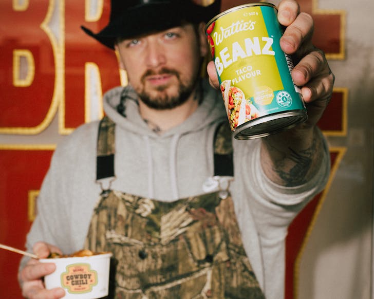 Sean Yarbrough holds a bowl of limited edition Cowboy Chili and a can of Wattie's new taco flavoured beans. 