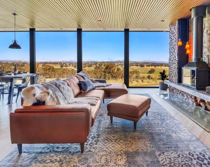 The fireplace and amazing view from Bulleroo Airbnb in Victoria