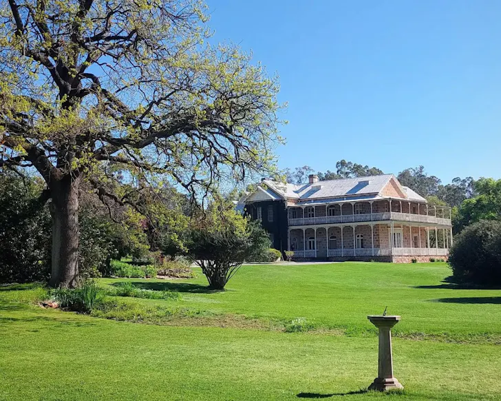 A view of Bungaree Station Clare Valley accommodation surrounded by grass and trees