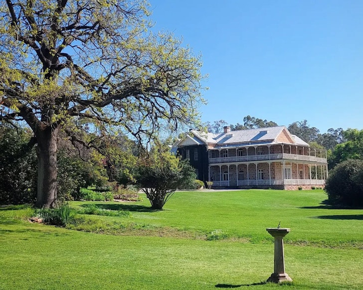 A view of Bungaree Station Clare Valley accommodation surrounded by grass and trees