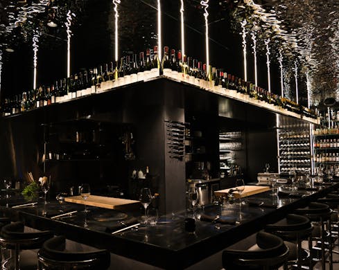An omakase kitchen encircled by fifteen dining seats