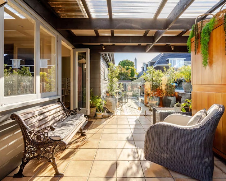 The view of the outdoor area with sauna at By The Lake one of the best Auckland Airbnbs